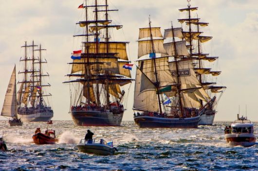 A Parade Of Boats In Amsterdam
