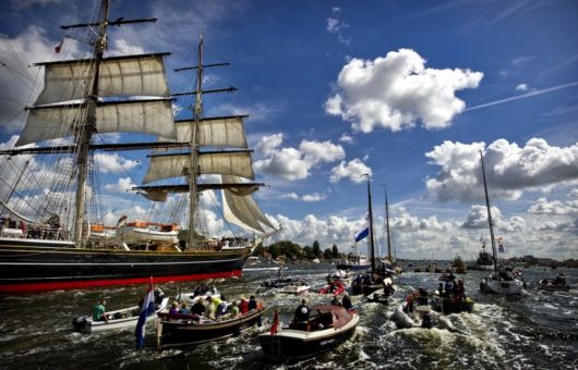 A Parade Of Boats In Amsterdam